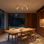 3-Head Travertine-Look Spotlight Ceiling Light above a dining area