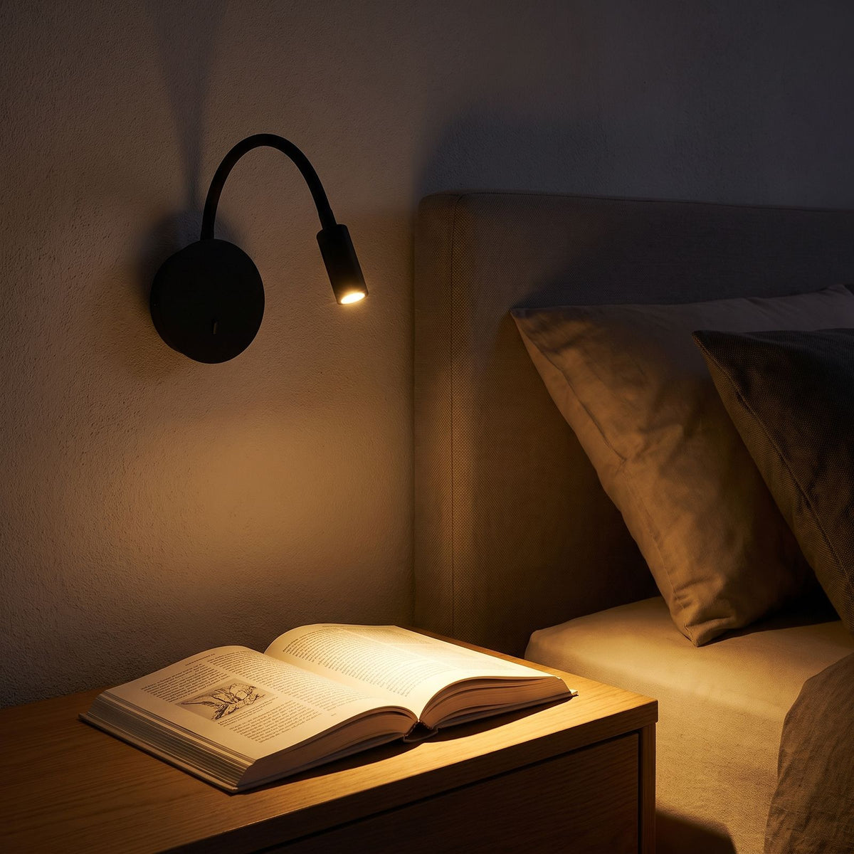360-Degree Adjustable Silicone LED Wall Light in a hallway above a timber console