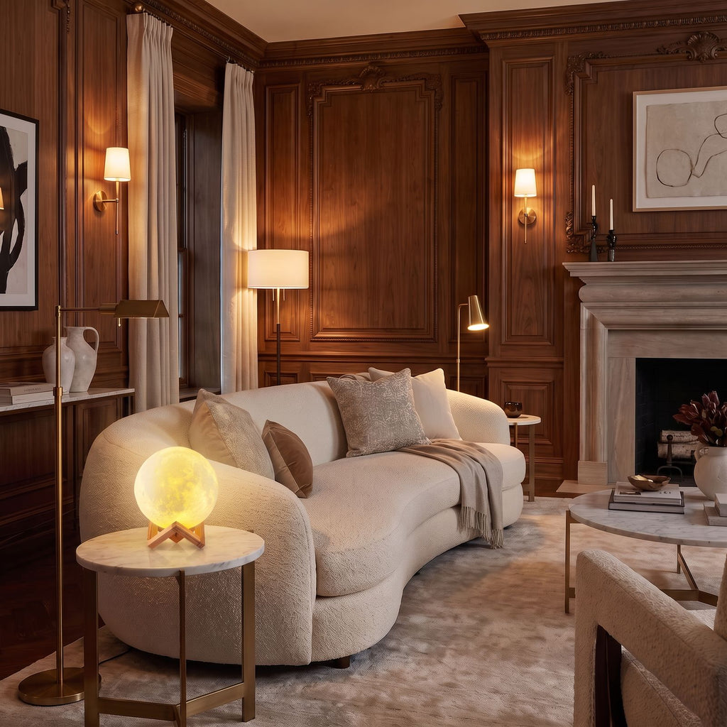3D Moon Lamp Rechargeable LED Table Lamp glowing warm on a marble side table beside a sofa in a classic panelled living room