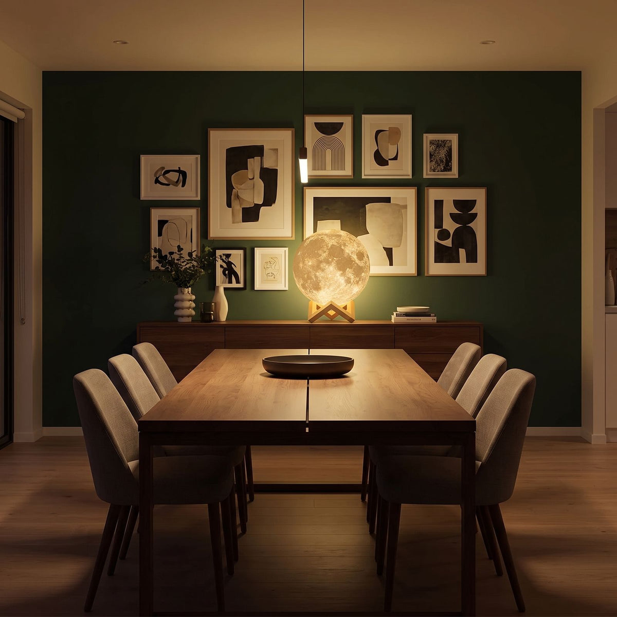 The 3D moon lamp in 20 cm as a centrepiece on a sideboard in a dining room at night
