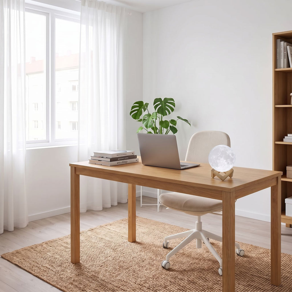 The 3D moon lamp on an oak desk in a bright home office