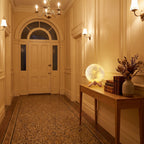 The 3D moon lamp in 18 cm on a timber console in a heritage entrance hallway in the evening