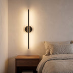Adjustable Bar and Disc LED Wall Sconce in a styled Australian interior with the light on