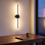 Bar and disc LED wall sconce above a home office desk