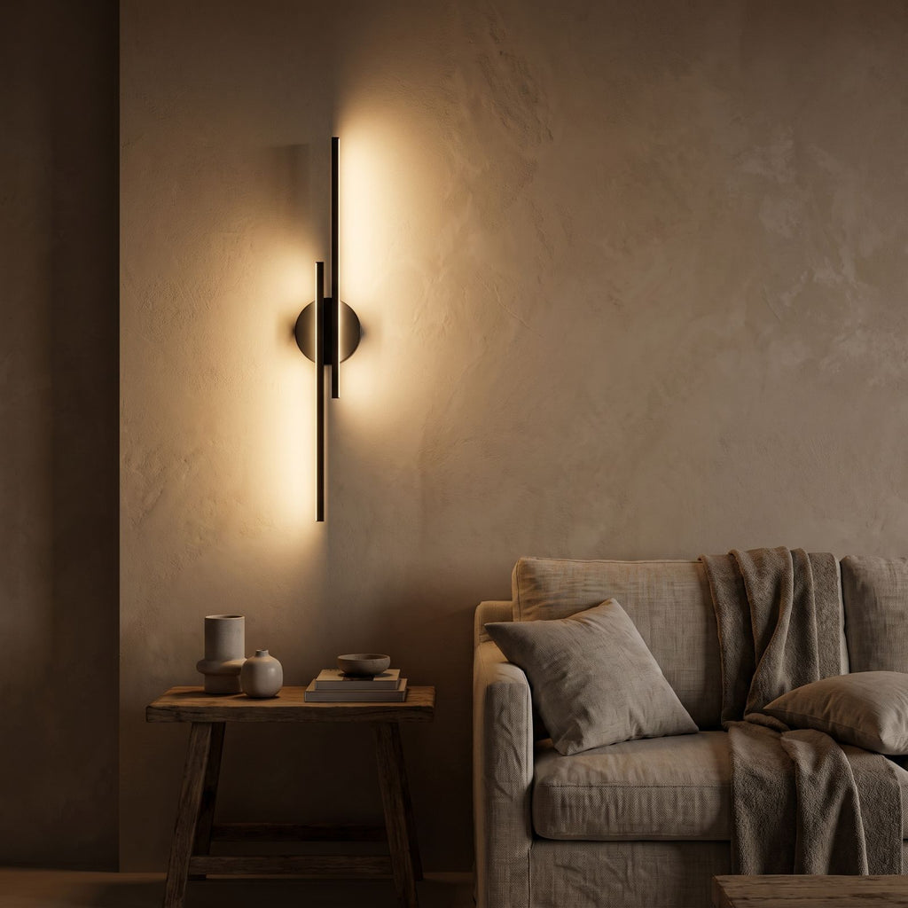 Adjustable Bar and Disc LED Wall Sconce seen in a wider evening interior