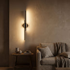 Adjustable Bar and Disc LED Wall Sconce seen in a wider evening interior