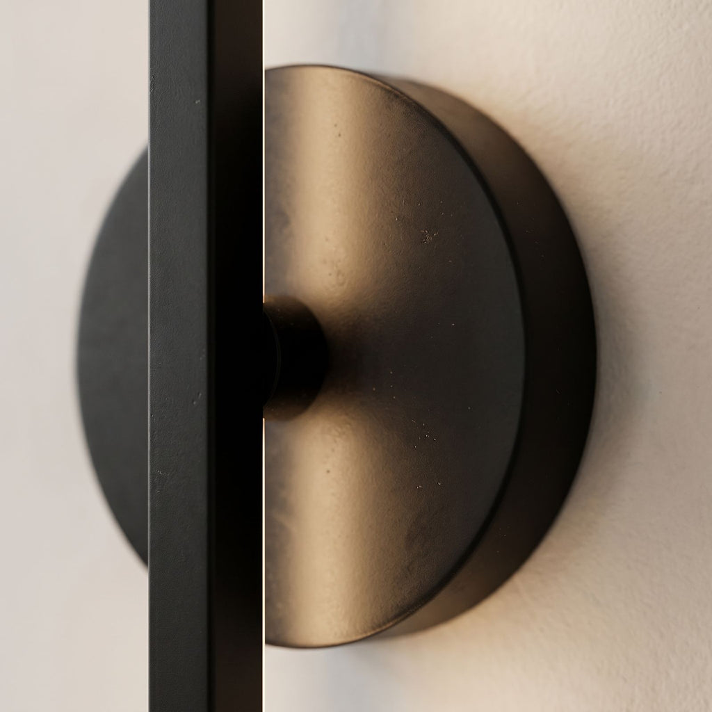 Close view of the material and finish of the Adjustable Bar and Disc LED Wall Sconce
