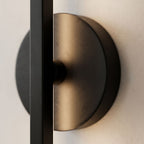 Close view of the material and finish of the Adjustable Bar and Disc LED Wall Sconce