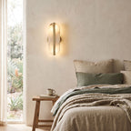 Alabaster and Brass Wall Sconce on a bedroom wall beside the bed