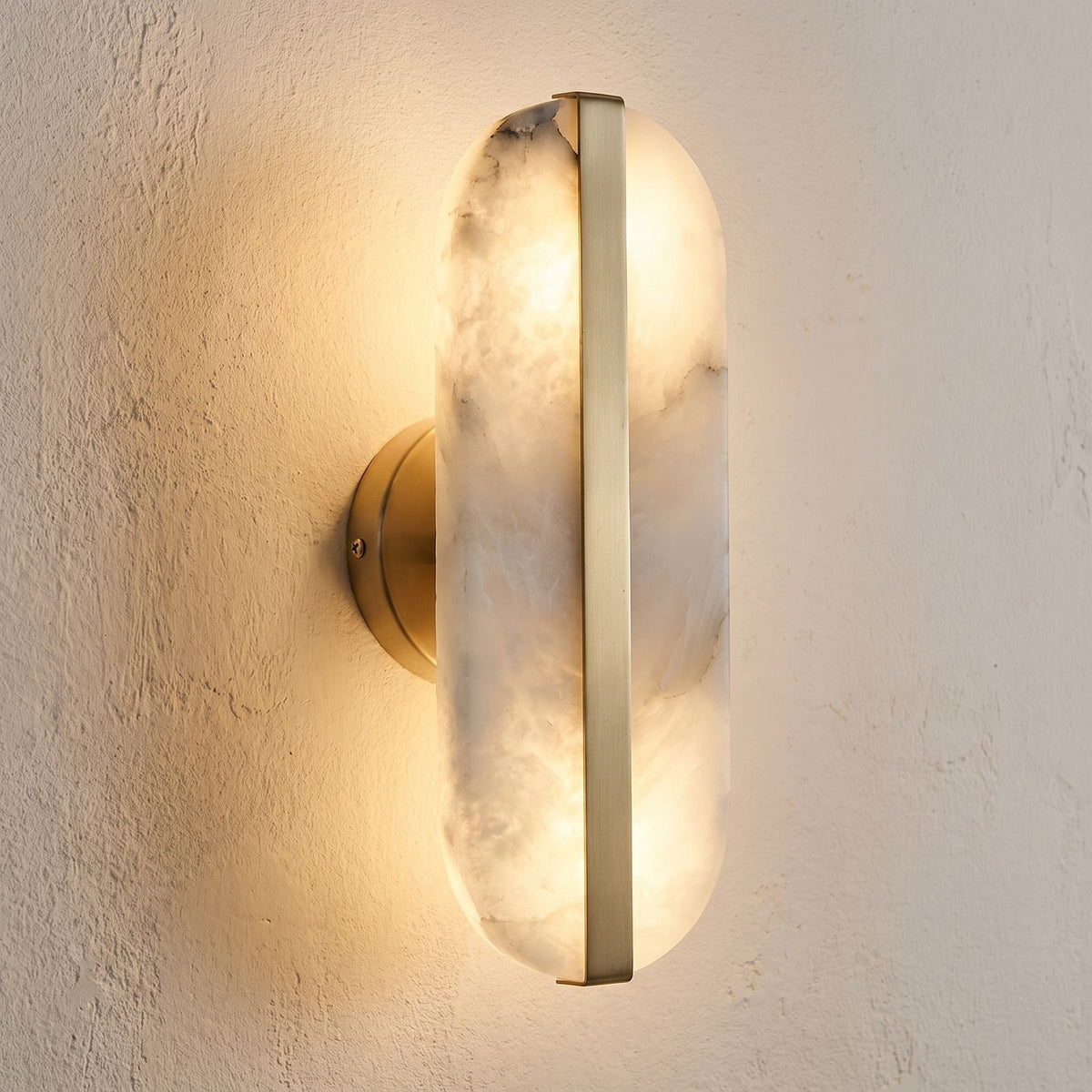 Alabaster and Brass Wall Sconce, close view at 45 degrees on a plaster wall