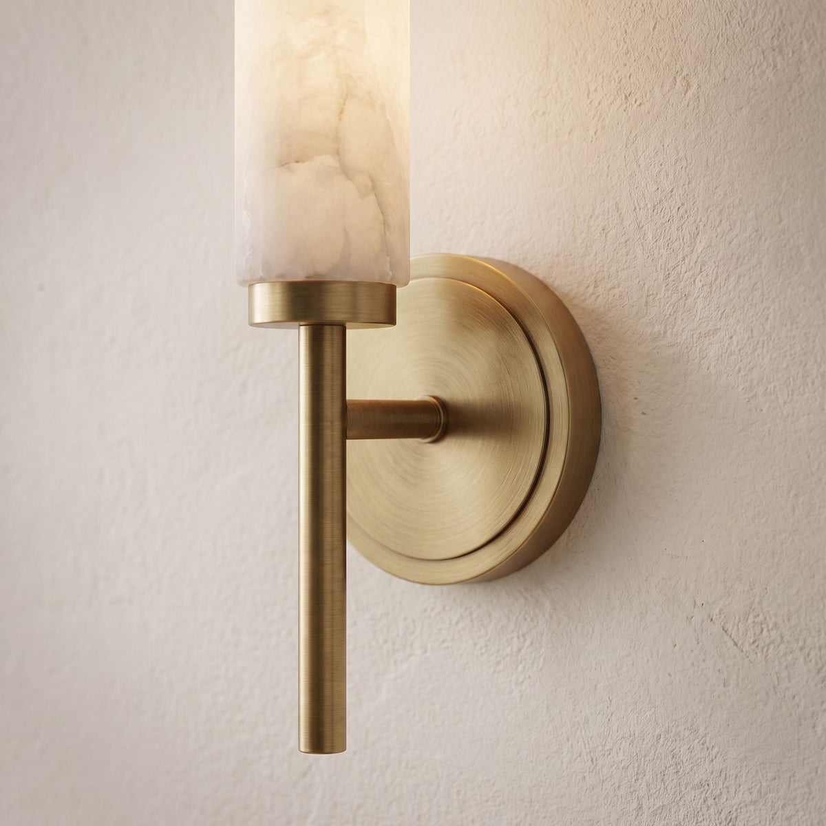 Alabaster Candle Brass Wall Sconce, close view at 45 degrees on a plaster wall