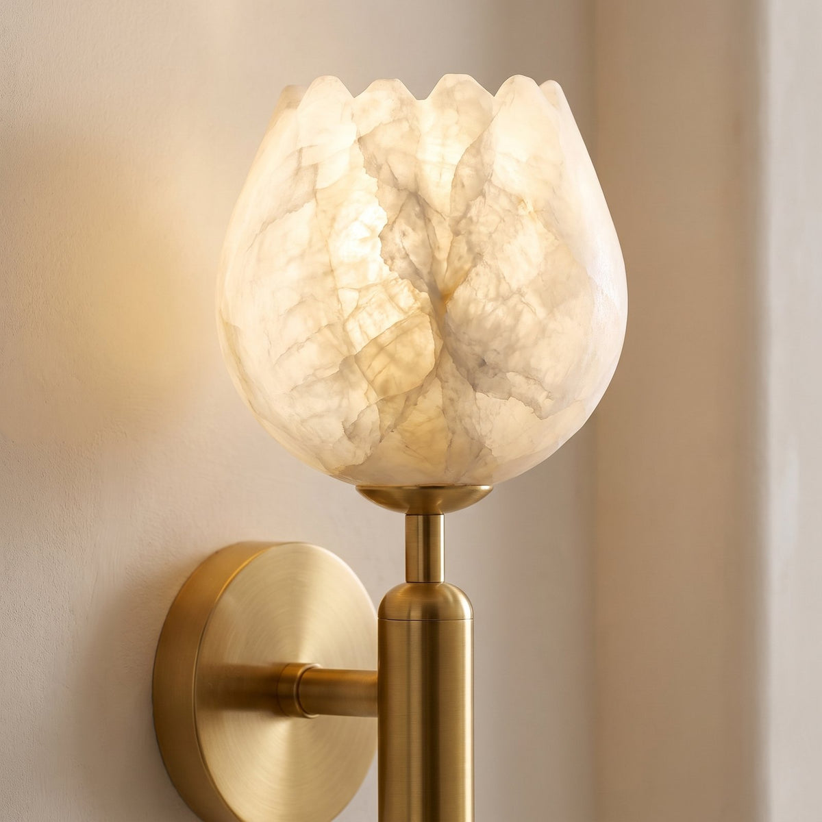 Marble Flower Petal Brass Wall Sconce, close view of the marble veining and brass