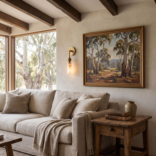 Alabaster-Look Glass Cylinder Drop Wall Light beside a sofa in a living room