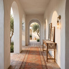 Alabaster-Look Glass Cylinder Drop Wall Light in a hallway