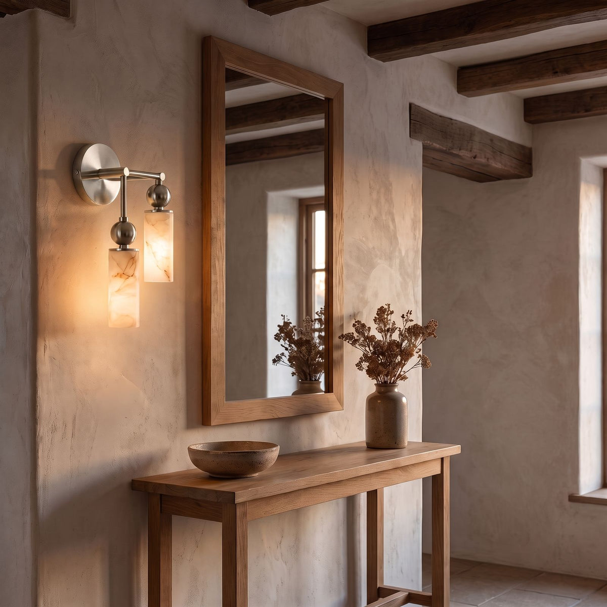 Alabaster-Look Glass Cylinder Drop Wall Light, 2 heads with the lower cylinder on the left, in nickel, in an entry hall