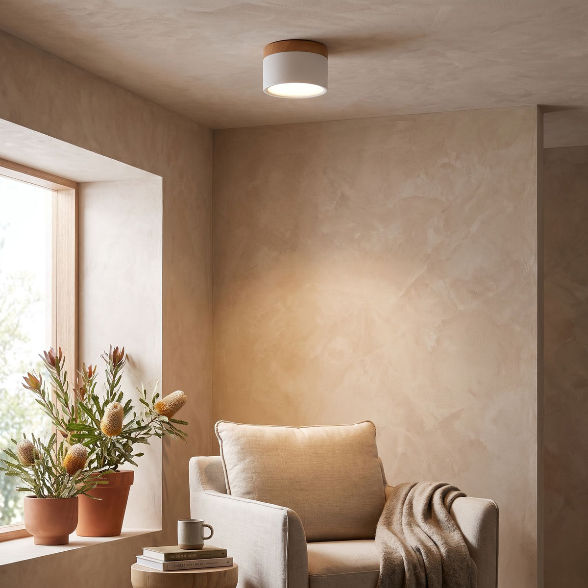 Aluminium Cylinder LED Spotlight Ceiling Light above a reading armchair