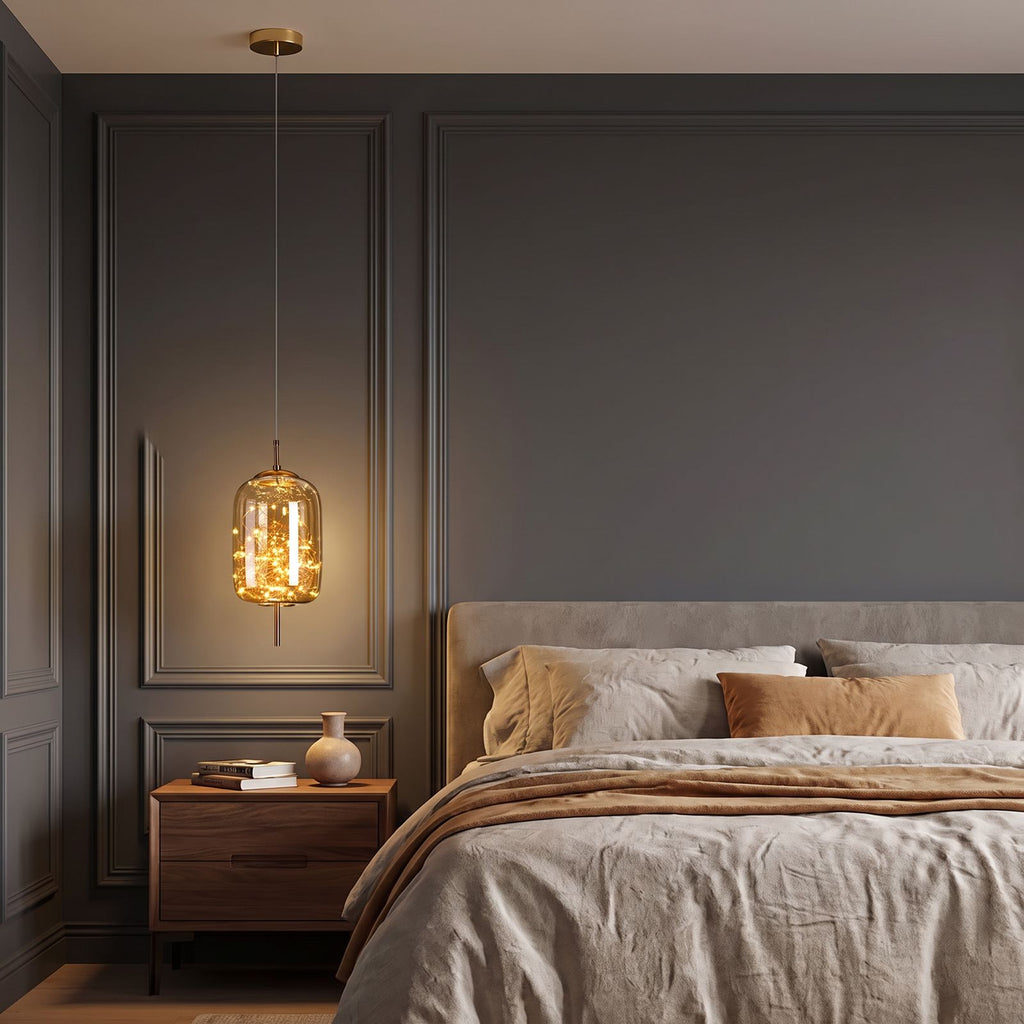 Amber Glass Capsule Starry LED Pendant Light hanging beside the bed above a walnut bedside table in a classic panelled bedroom at dusk