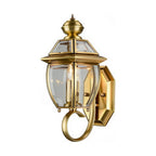 Antique Brass Glass Outdoor Wall Lantern on a white background