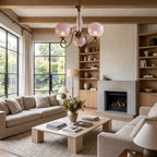 Antique Brass Scroll Arm Glass Globe Chandelier above a coffee table in a living room in daylight