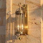 Arabian Style Brass and Glass Outdoor Wall Lantern, close view at 45 degrees on a stone wall