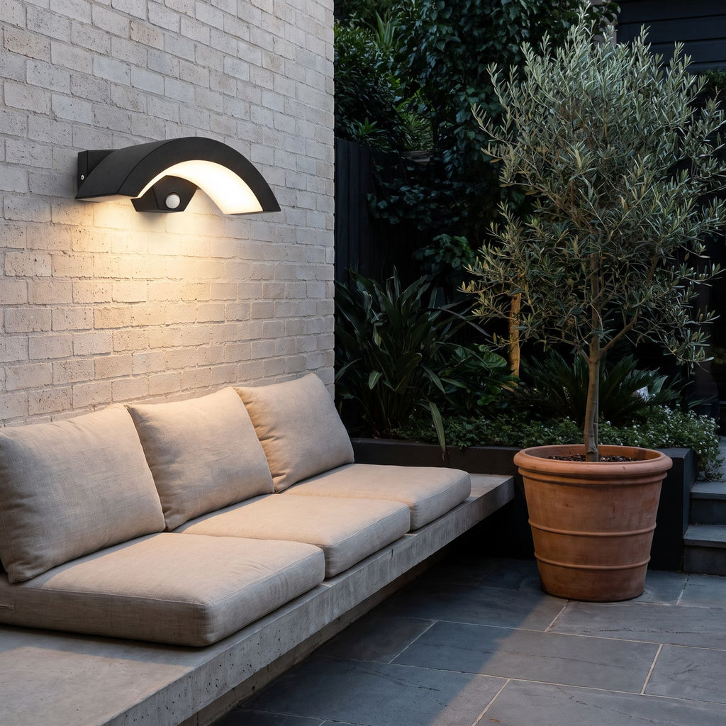 Arc Motion Sensor Outdoor Wall Light above a courtyard bench