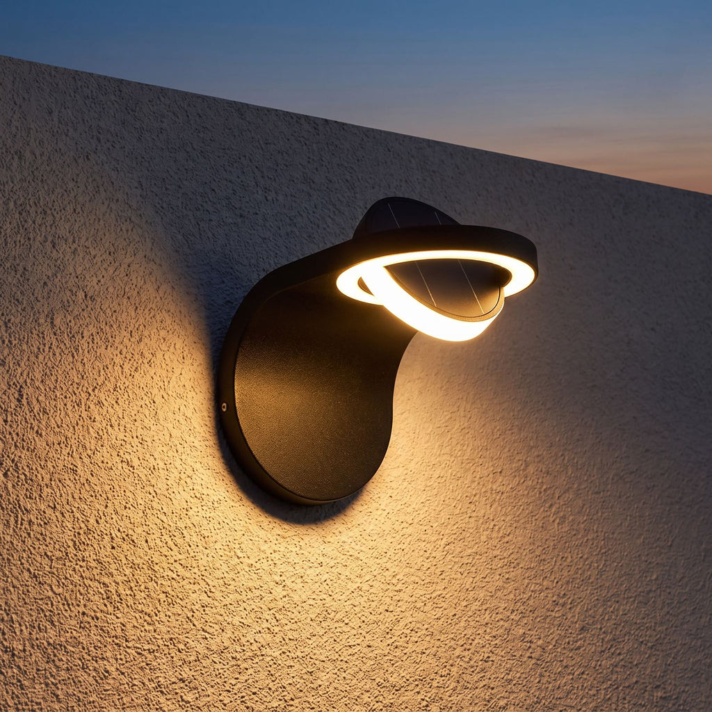 Arched Metal and Acrylic Outdoor Wall Light on a porch wall at dusk