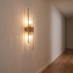 Crystal glass rod wall light on a hallway wall