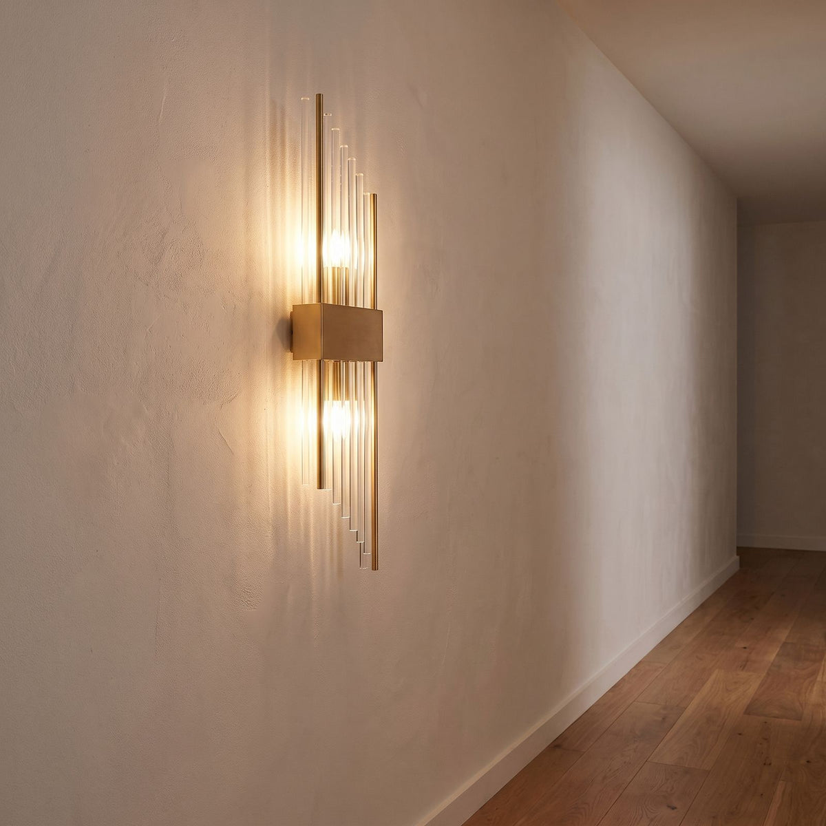 Crystal glass rod wall light on a hallway wall