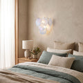 Art Deco Fan Textured Glass Wall Light on a bedroom wall beside the bed