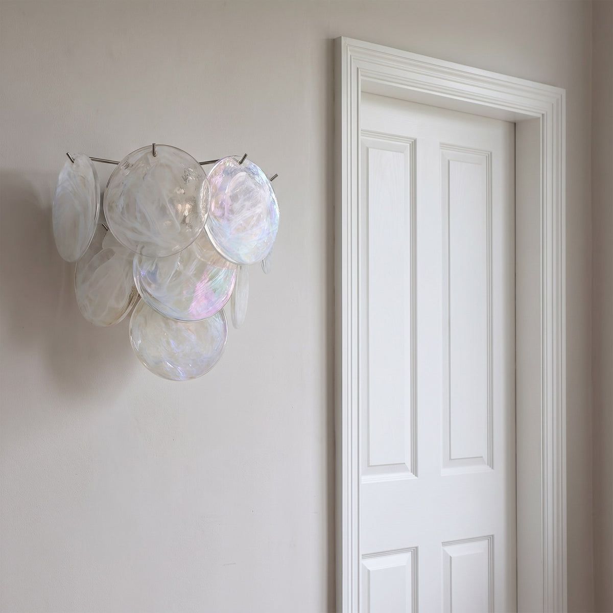 Art Deco Fan Textured Glass Wall Light beside a doorway, showing its size
