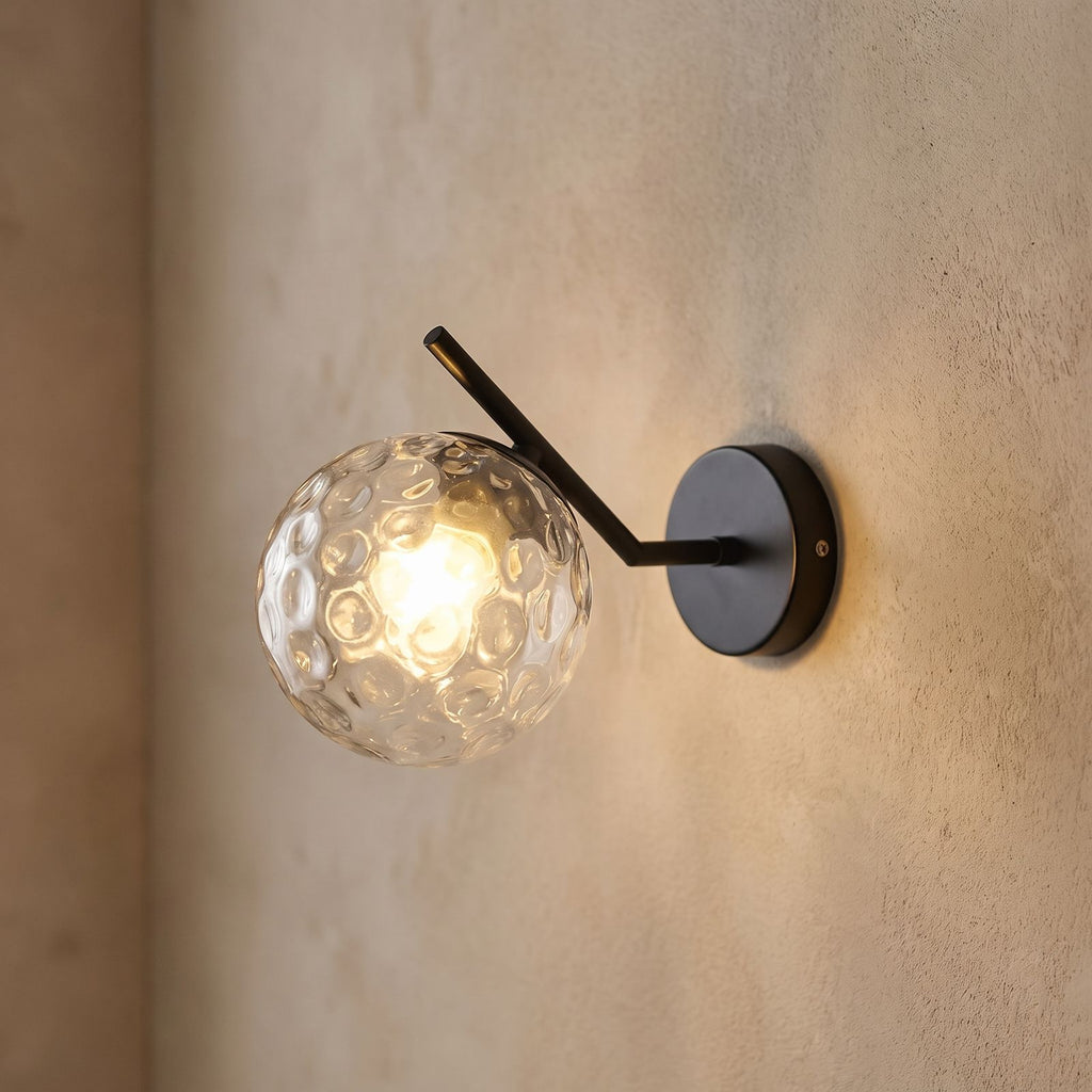 Art Deco Glass Ball Up Down Wall Sconce, close view at 45 degrees on a plaster wall