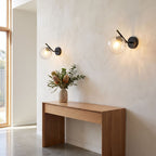 Art Deco Glass Ball Up Down Wall Sconce in a pair on a wall of an Australian home