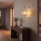 Art Deco Metal Rod and Clear Glass Up Down Wall Light in a hallway above a timber console