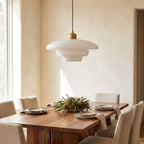 Art Deco Tiered Glass and Brass Pendant Light above a timber dining table