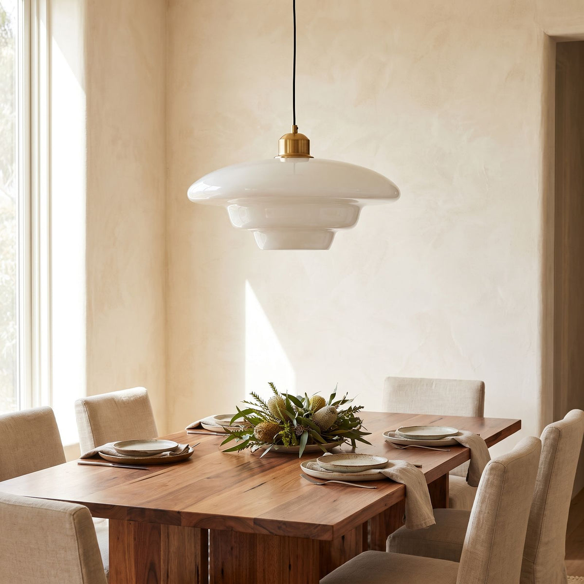 Art Deco Tiered Glass and Brass Pendant Light above a timber dining table