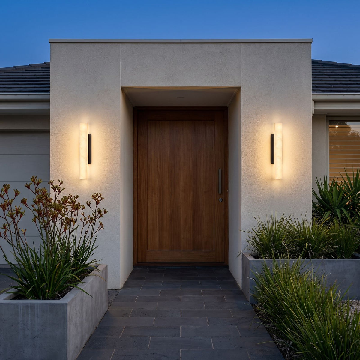 A pair of Artificial Alabaster Rectangular Outdoor Wall Lights either side of a timber entry door
