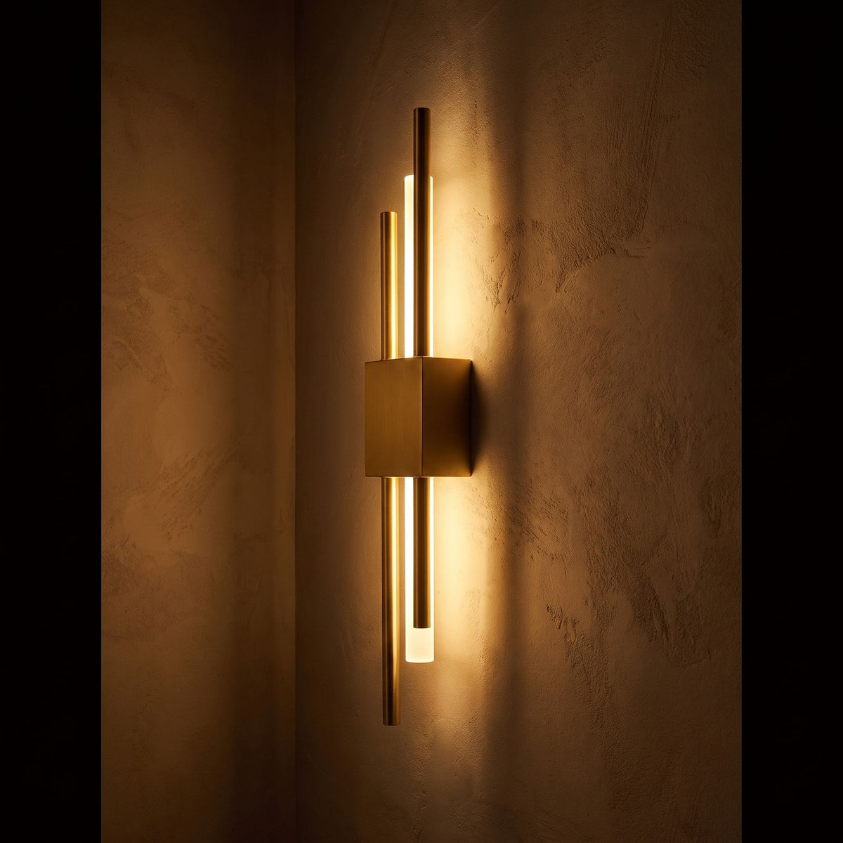 Asymmetric Linear LED Wall Sconce glowing on a plaster wall at night