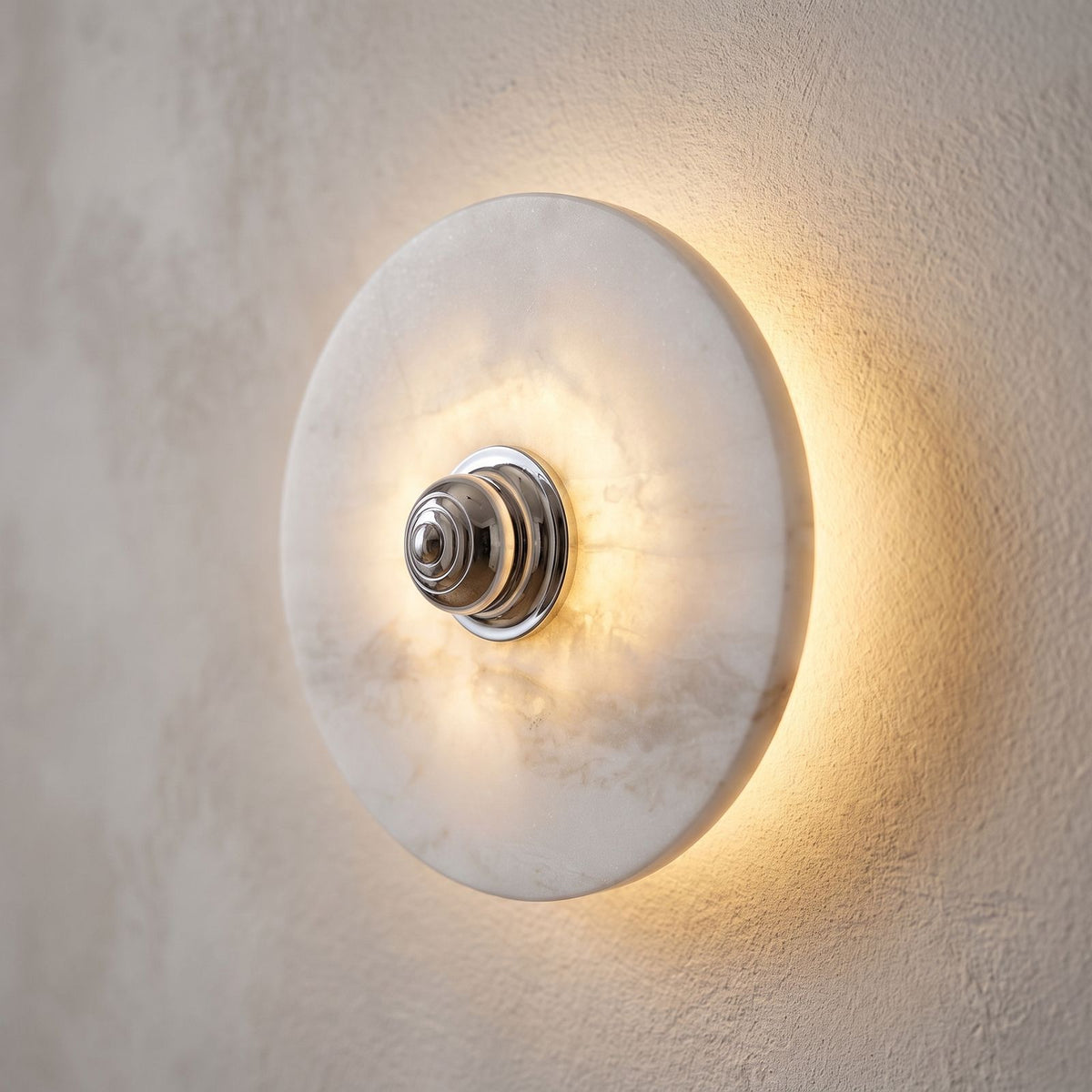 Backlit Marble Disc Touch Wall Light, close view at 45 degrees on a plaster wall