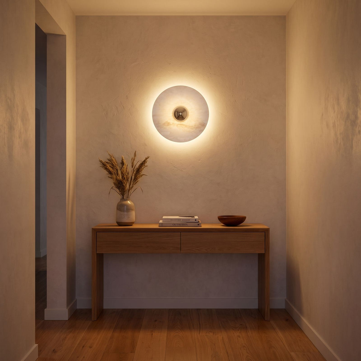 Backlit Marble Disc Touch Wall Light in a hallway above a timber console