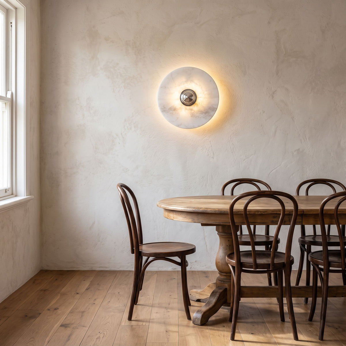 Backlit Marble Disc Touch Wall Light on a dining room wall