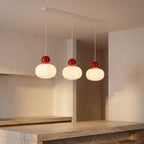 Ball-Top Scalloped Acrylic 3-Light Pendant Light over a kitchen island