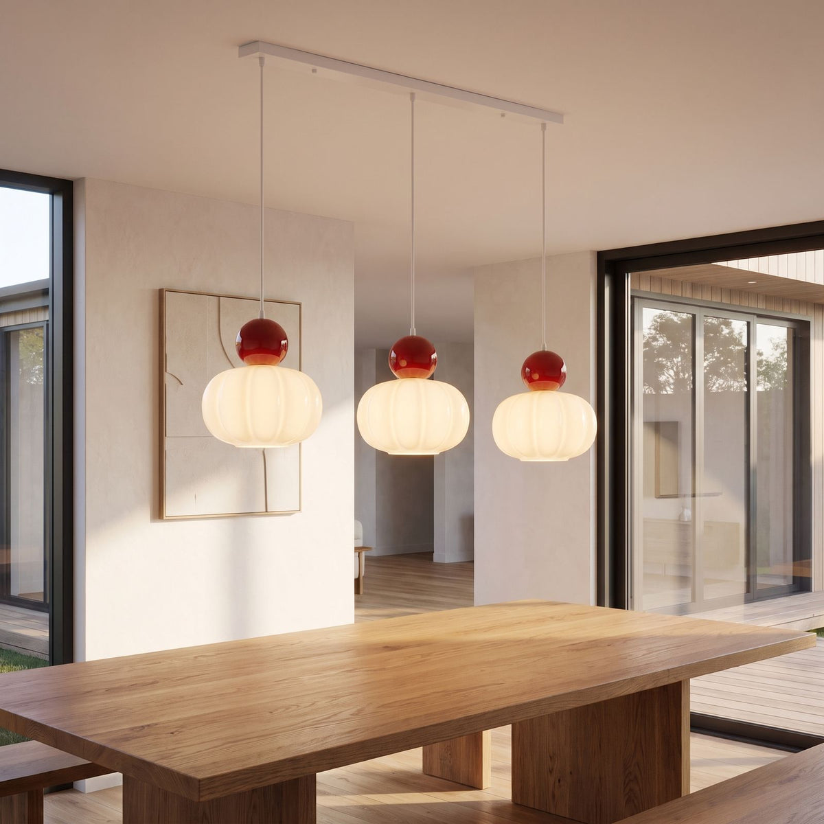 Ball-top scalloped acrylic 3-light pendant above a dining table in daylight