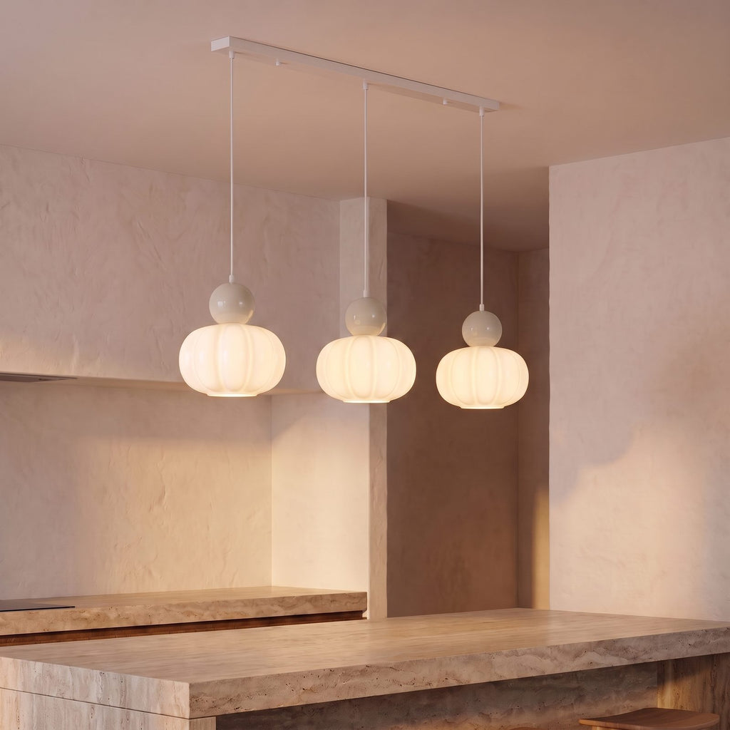 Ball-Top Scalloped Acrylic 3-Light Pendant Light with sand balls over a kitchen island