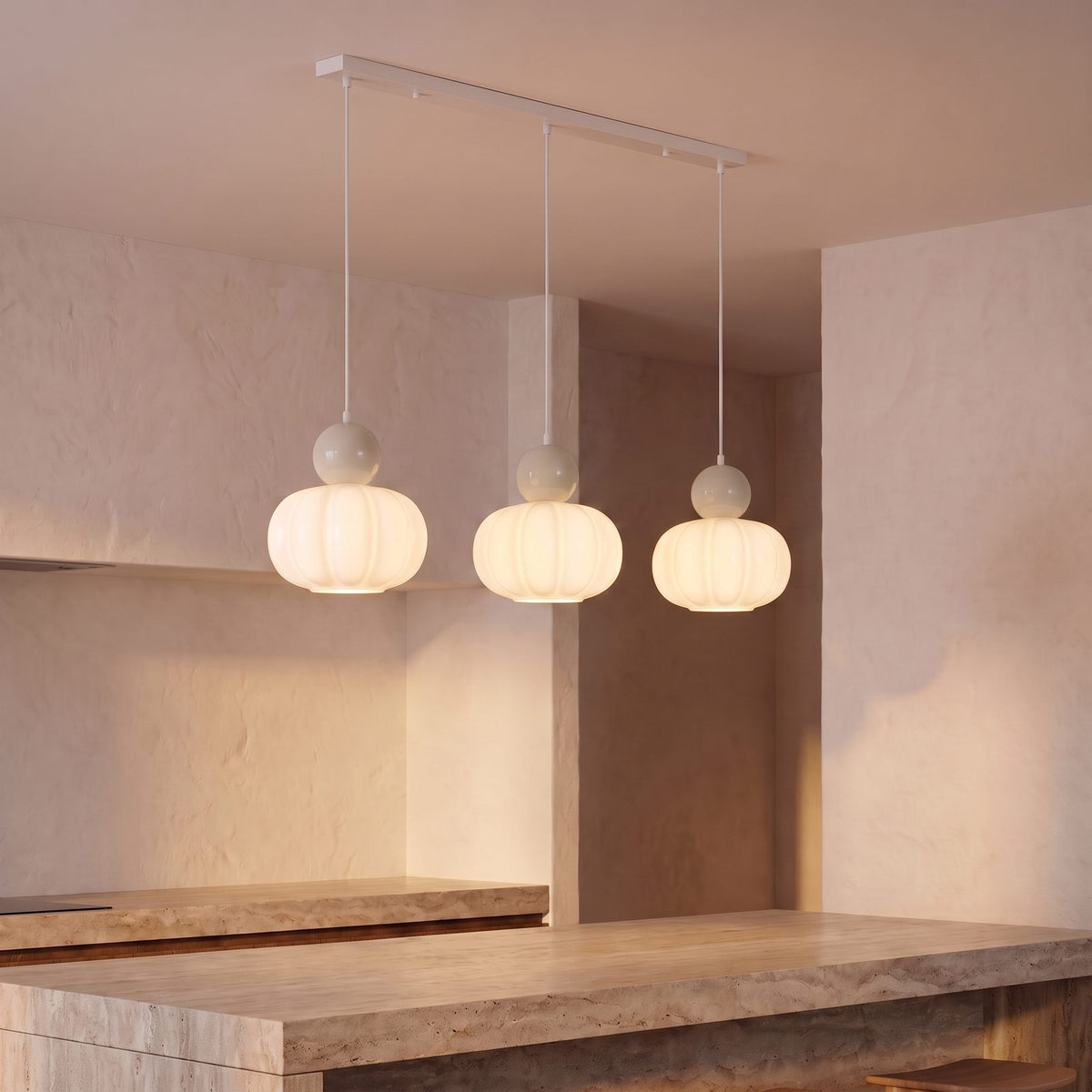 Ball-Top Scalloped Acrylic 3-Light Pendant Light with sand balls over a kitchen island