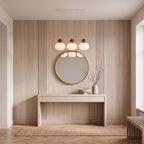 Ball-top scalloped acrylic 3-light pendant above a console table in an entrance hall