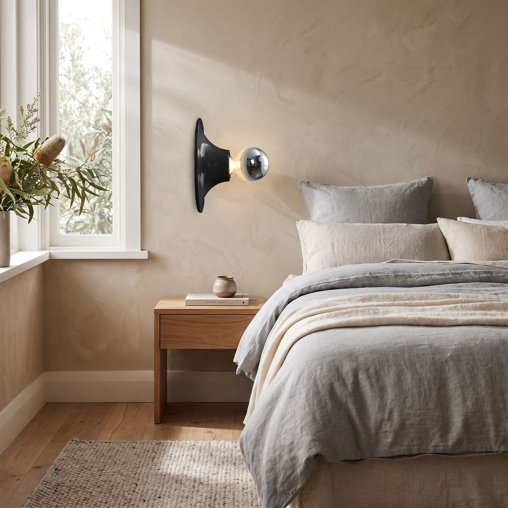 Bauhaus Retro Iron Wall Light on a bedroom wall beside the bed