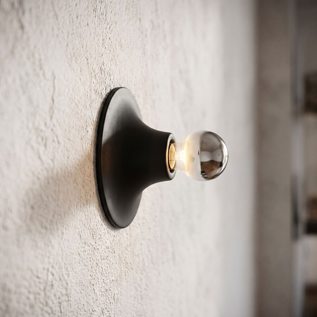 Bauhaus Retro Iron Wall Light, close view at 45 degrees on a plaster wall