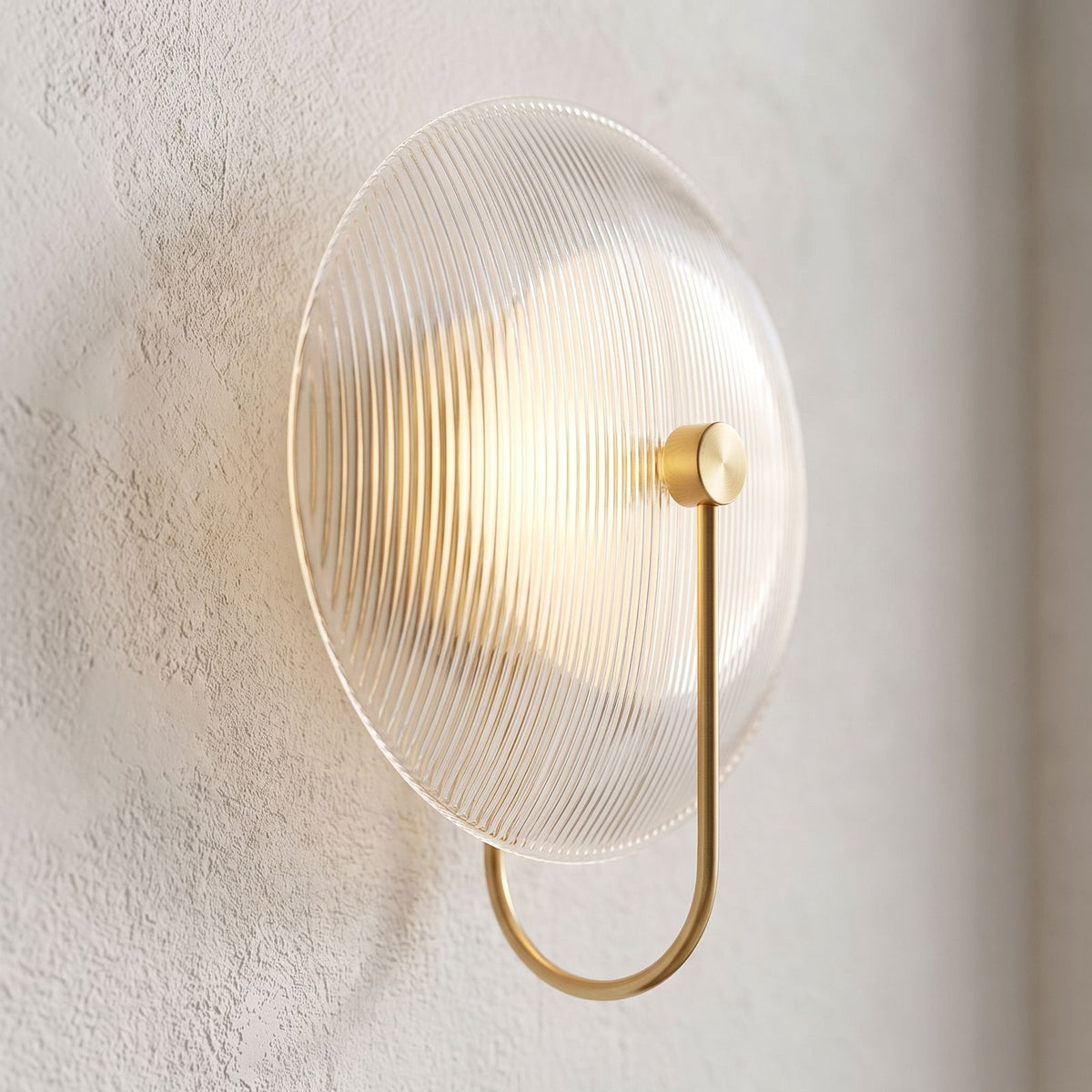 Bent Rod Round Glass Wall Light, close view at 45 degrees on a plaster wall