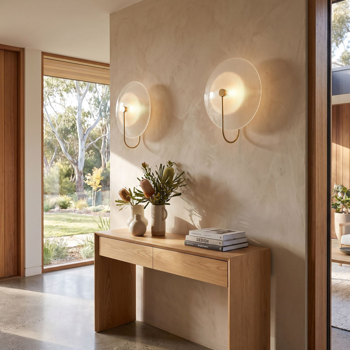 Bent Rod Round Glass Wall Light in a pair on a wall of an Australian home