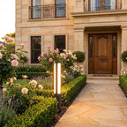 Black Aluminium Cylinder White Diffuser LED Bollard Light beside a front garden path at golden hour